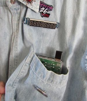 circuit board in the front pocket, below a digital display