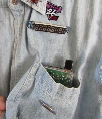 circuit board in the front pocket, below a digital display